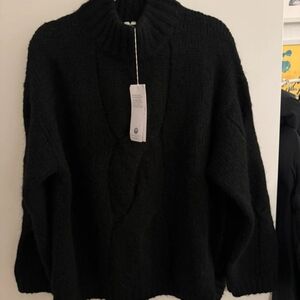 The sweater is 100% wool from Arket